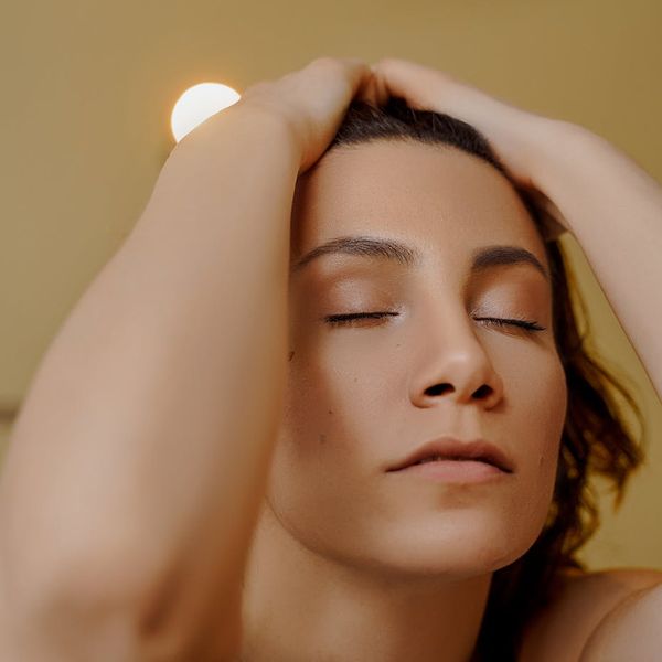 Serene person with closed eyes, feeling relaxed and focused.